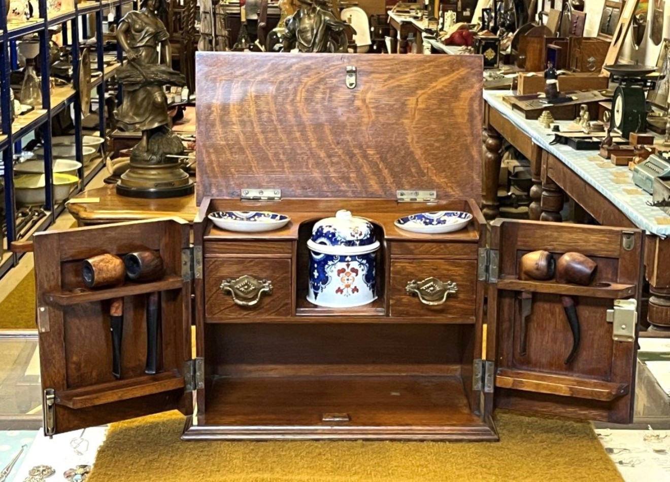 Edwardian Oak Smoker's Cabinet with Ornate Carved Door Panels and Original Ceramic Tobacco Jar and Dishes