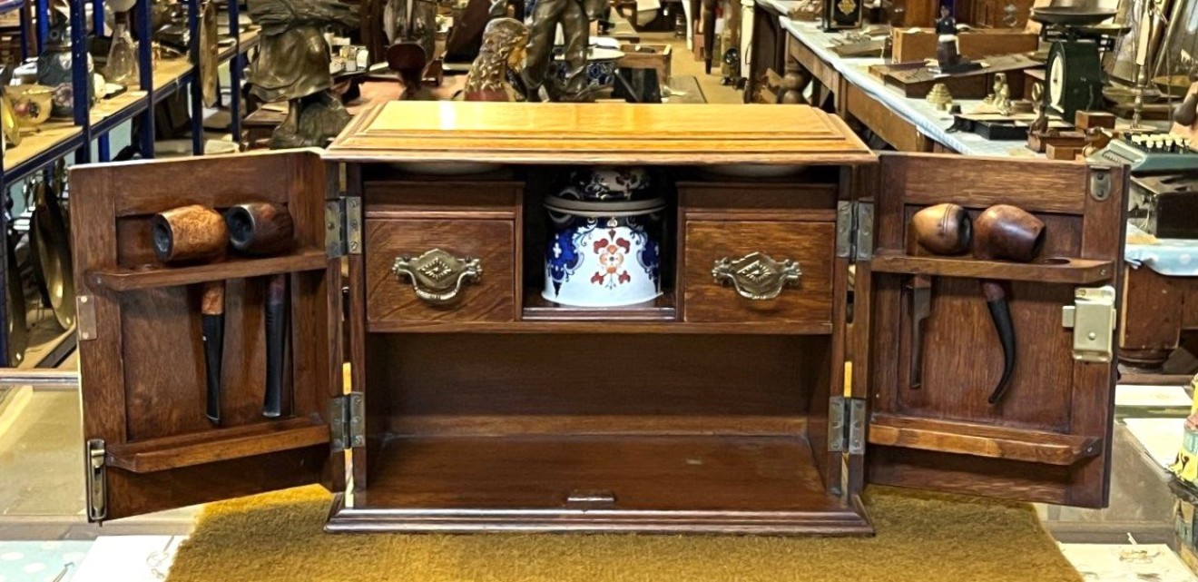 Edwardian Oak Smoker's Cabinet with Ornate Carved Door Panels and Original Ceramic Tobacco Jar and Dishes