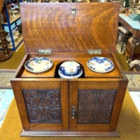 Edwardian Oak Smoker's Cabinet with Ornate Carved Door Panels and Original Ceramic Tobacco Jar and Dishes b