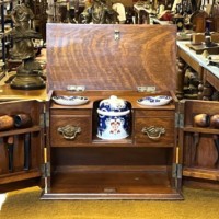 Edwardian Oak Smoker's Cabinet with Ornate Carved Door Panels and Original Ceramic Tobacco Jar and Dishes