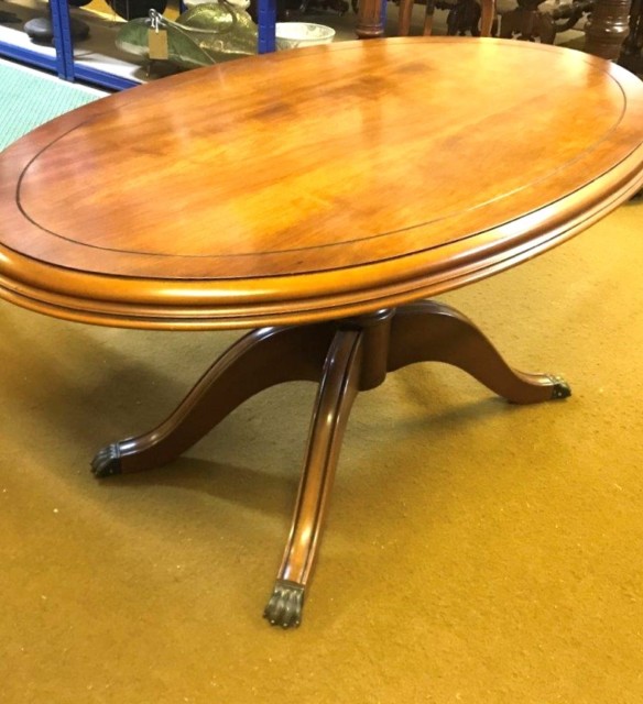 Vintage Mahogany Oval Regency Style Coffee Table with Brass Claw Feet