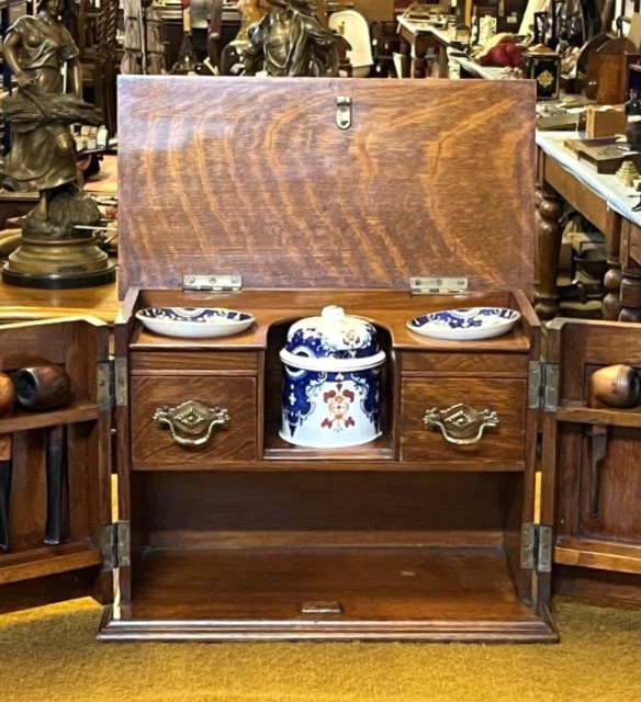 Edwardian Oak Smoker's Cabinet with Ornate Carved Door Panels and Original Ceramic Tobacco Jar and Dishes